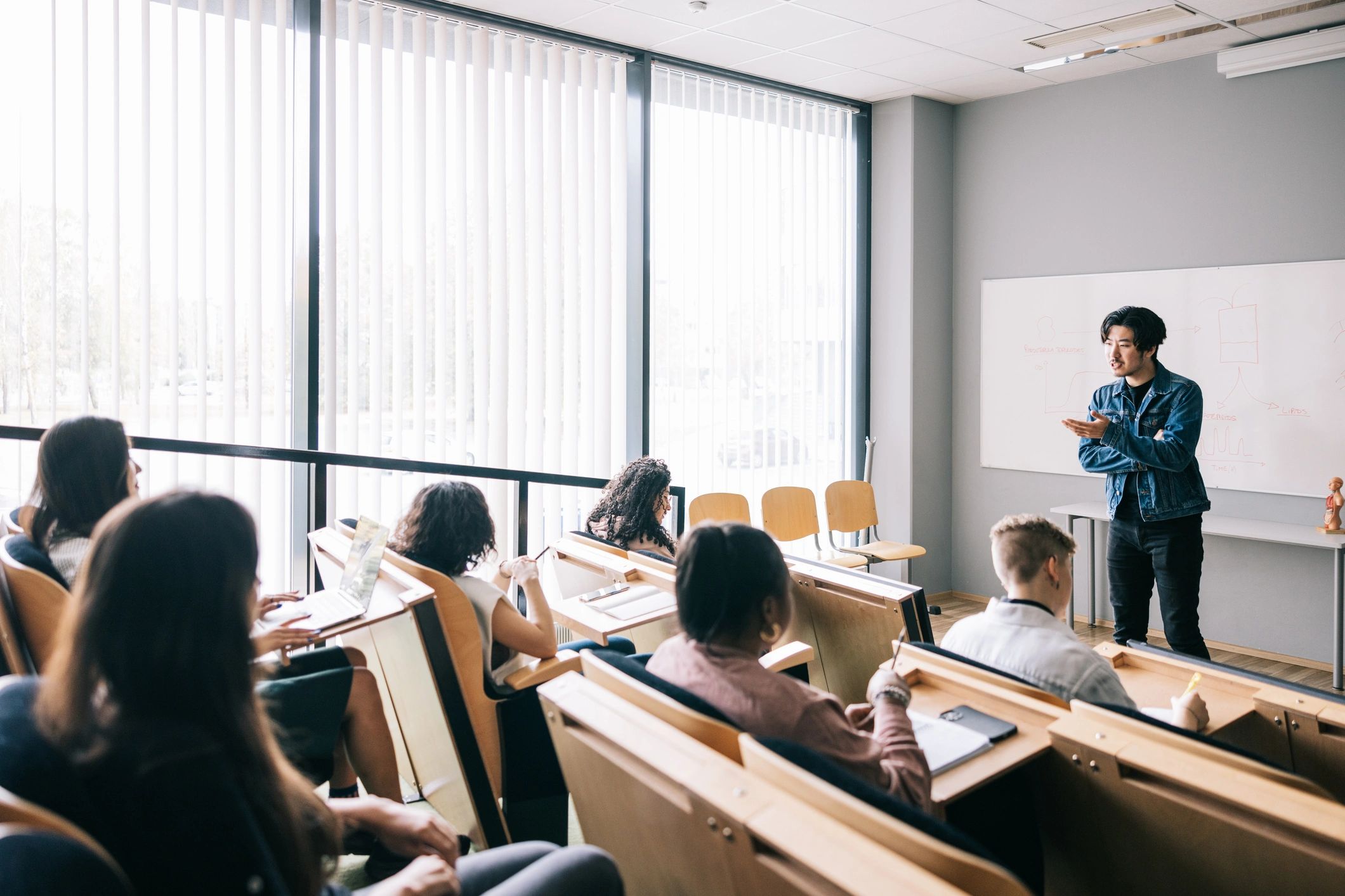 Photo series of university lecture with multi-ethnic group of students.