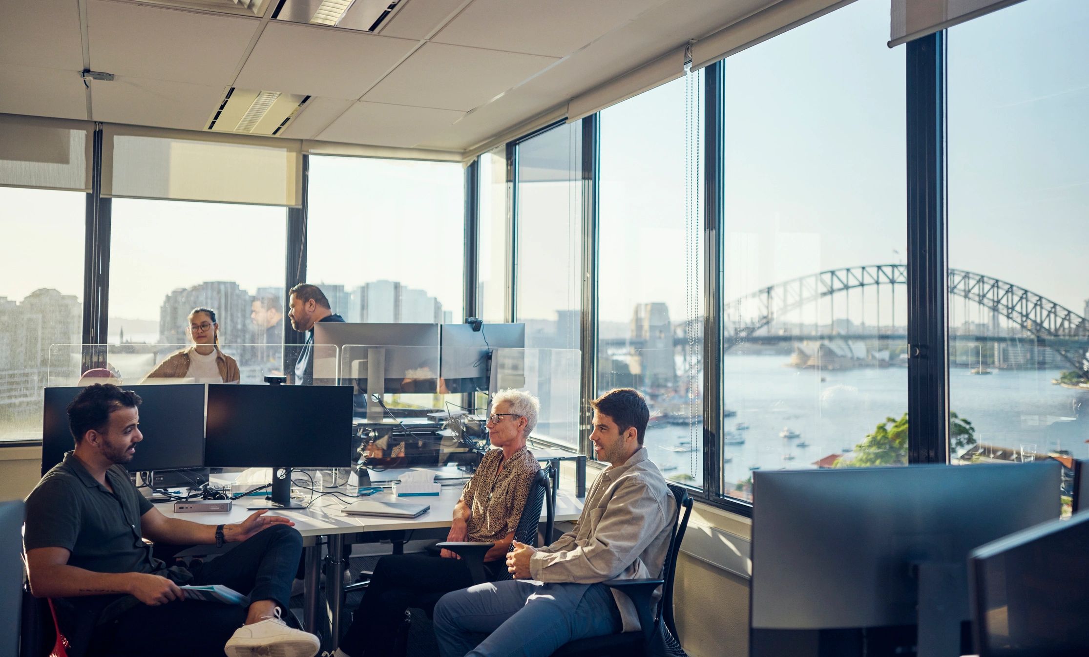 Colleagues collaborating in a modern office meeting
