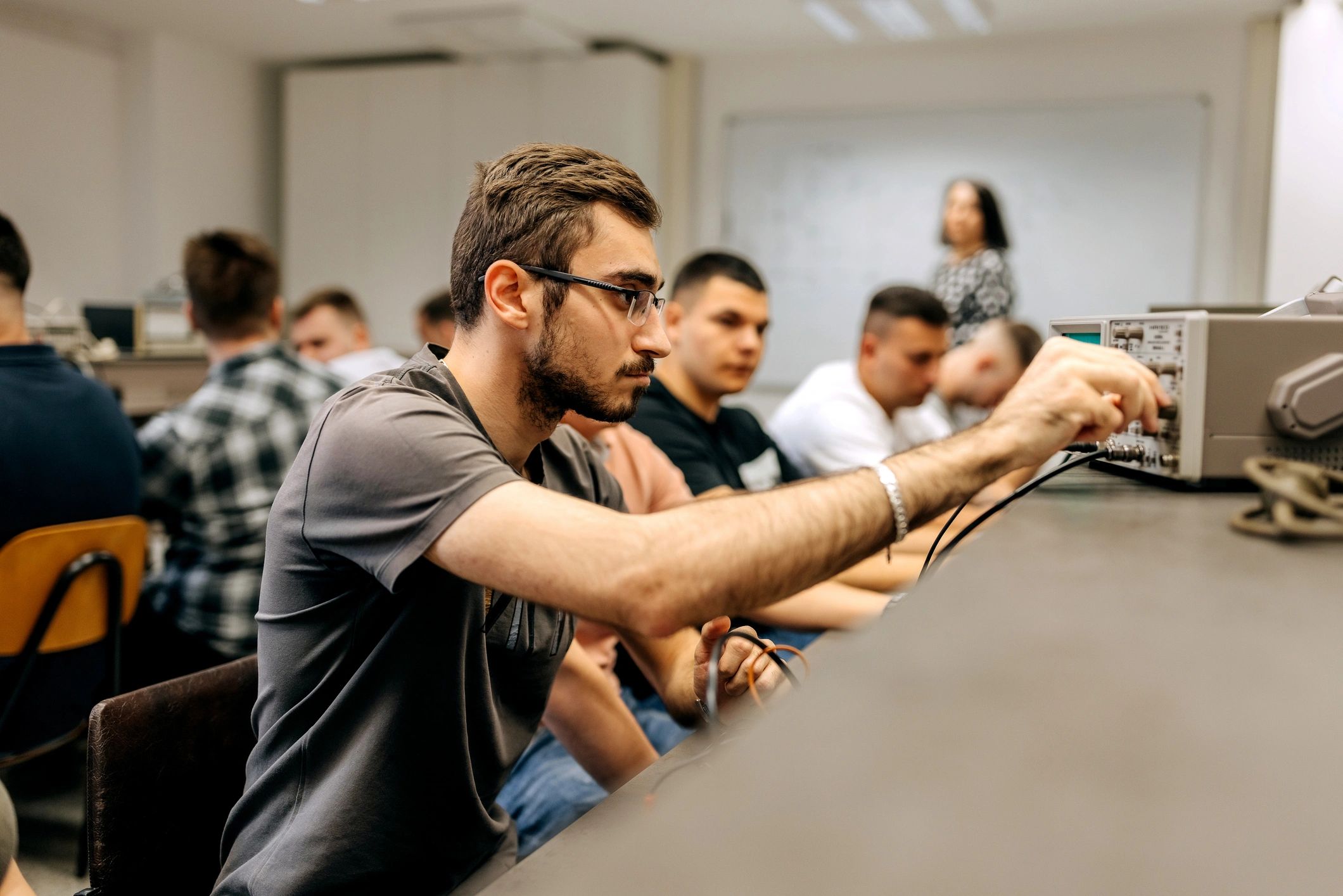 Engineering Student using oscillograph at the classroom