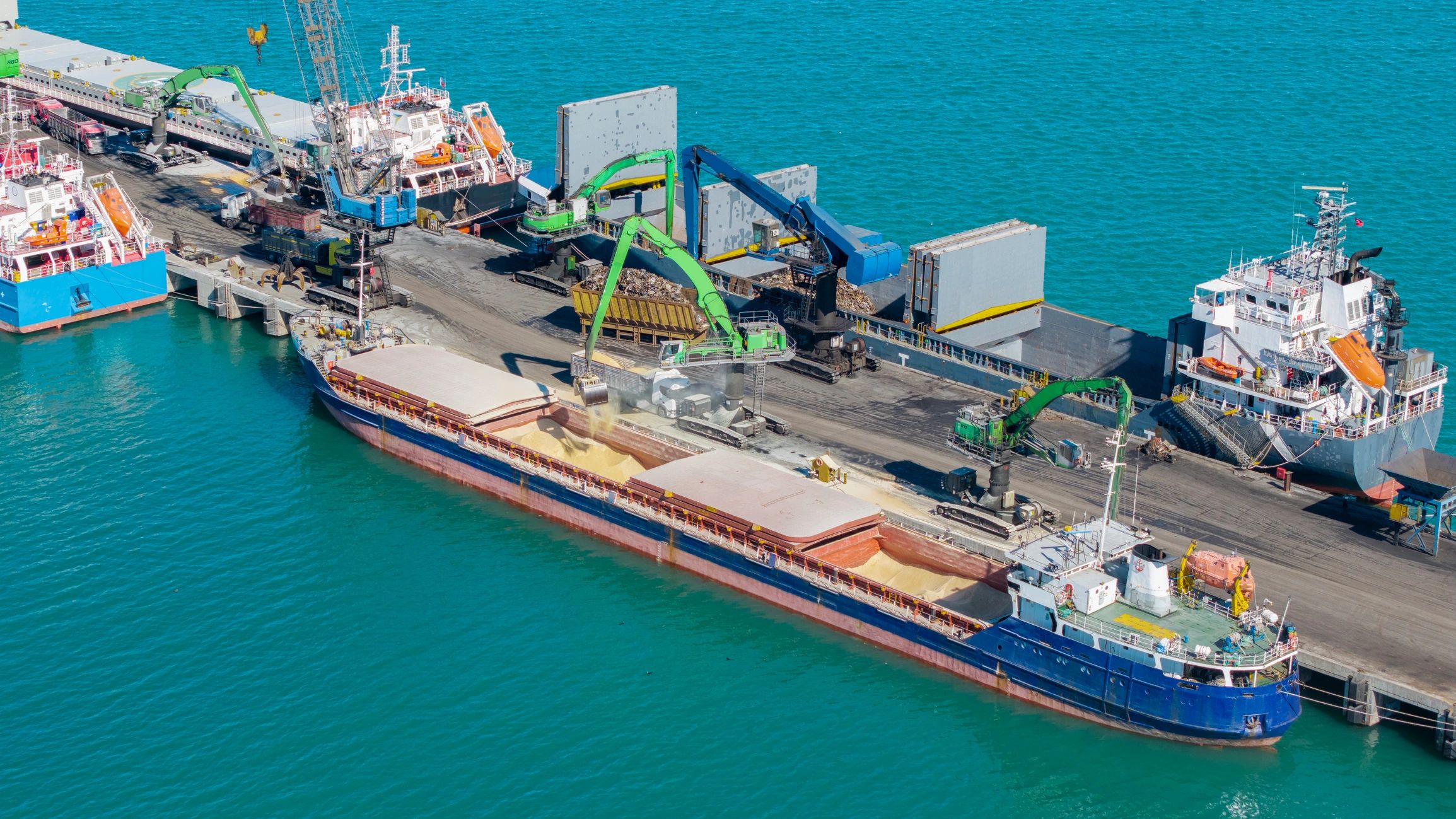 Cargo ship loading at industrial dock