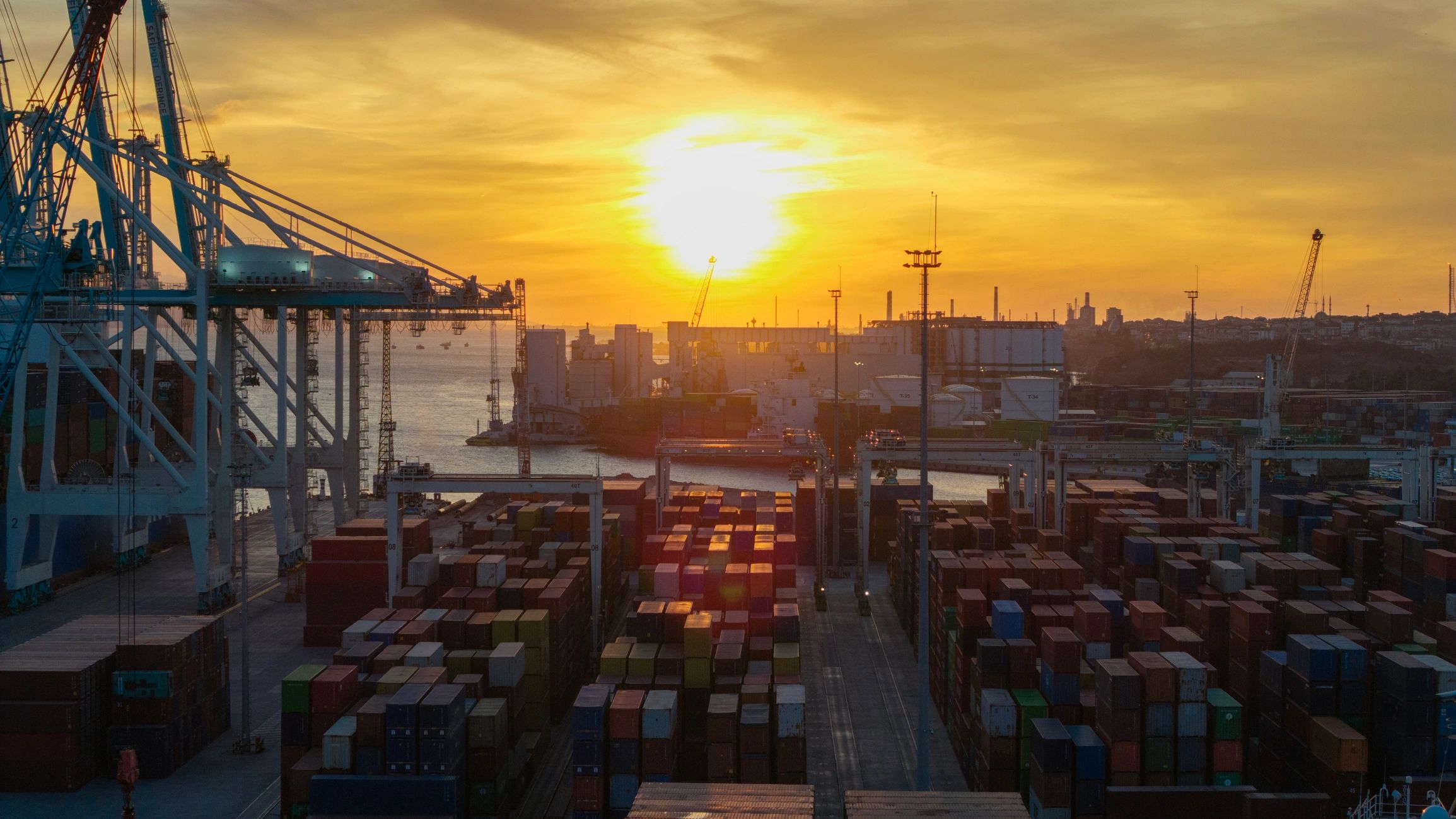 Aerial view of a container port at sunset