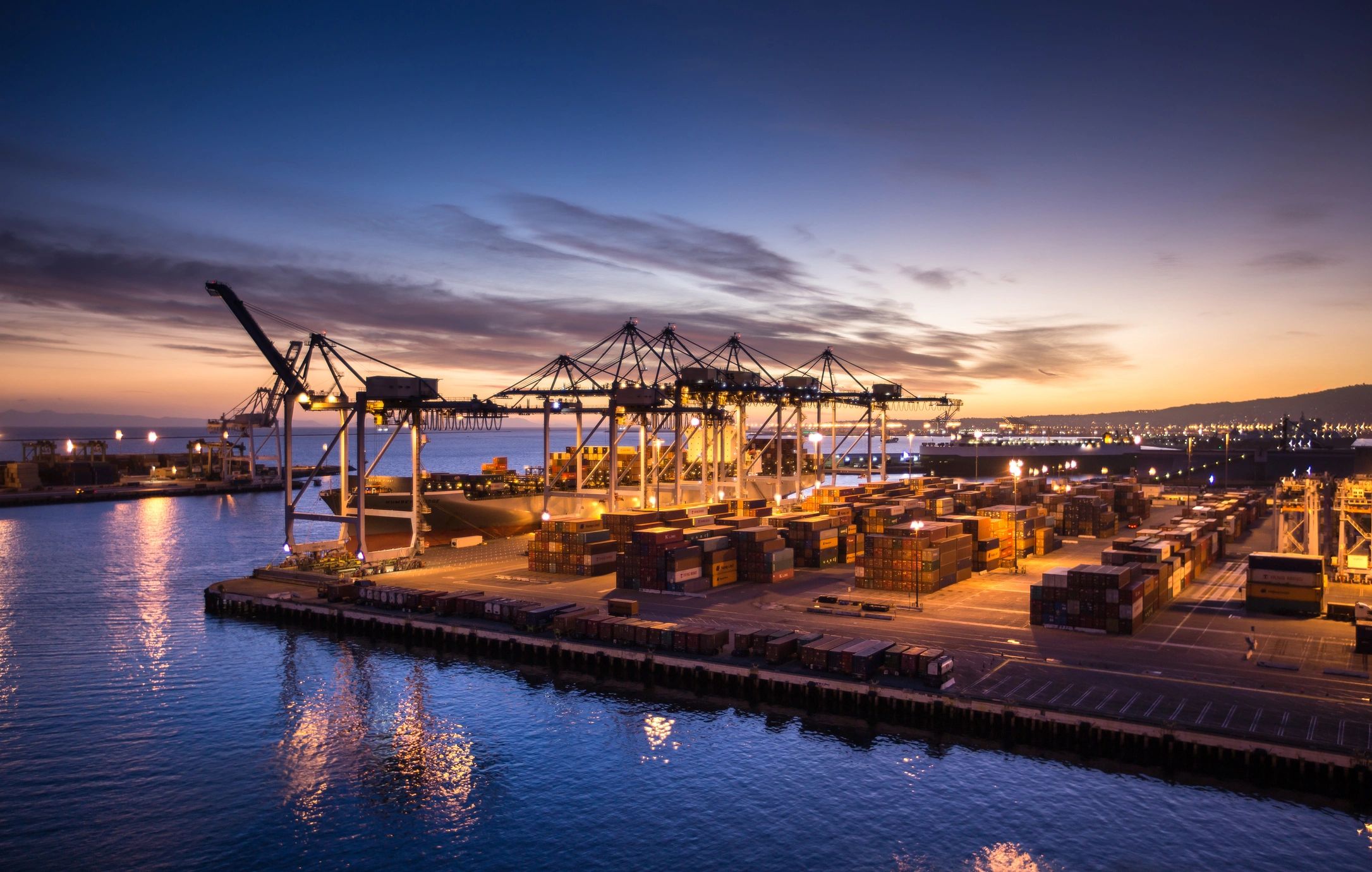 Ship Unloading in Port at Sunset - Twilight